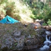 This tiny little creek is the headwaters of a big river. You'd know it if I told you. River valleys tend to be lushly overgrown so finding somewhere to set up a tent can be hard. This handy, more or less flat, rock ledge has been kept clear by spring snow melts.