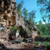 Cliff beside a river. A cliff few have seen.