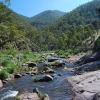 Calm water flows over rocks.